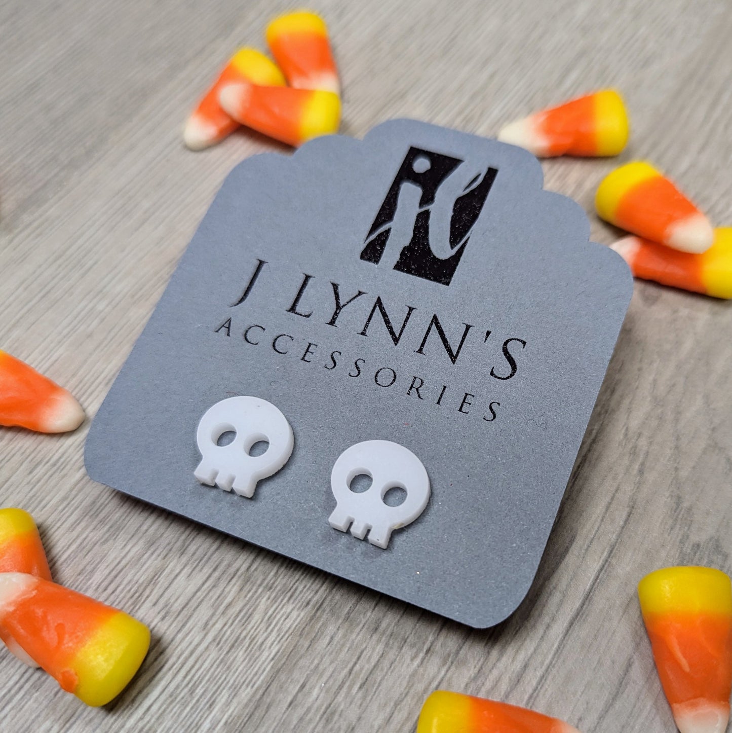 Acrylic skull earrings in white