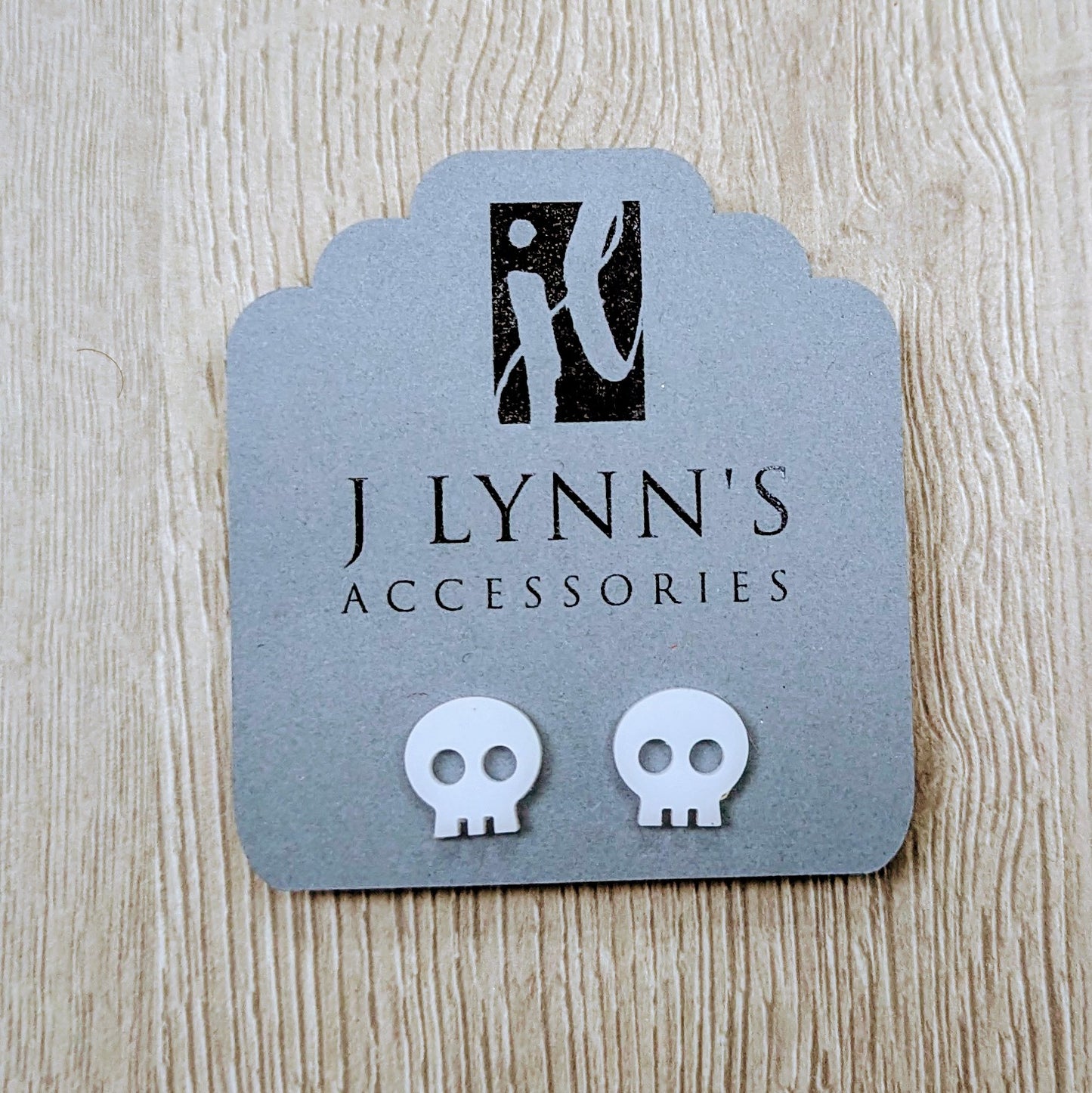 Acrylic skull earrings in white