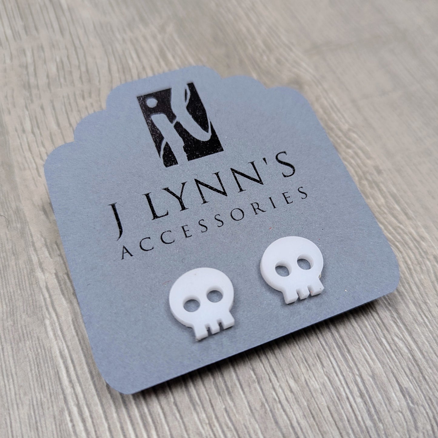 Acrylic skull earrings in white