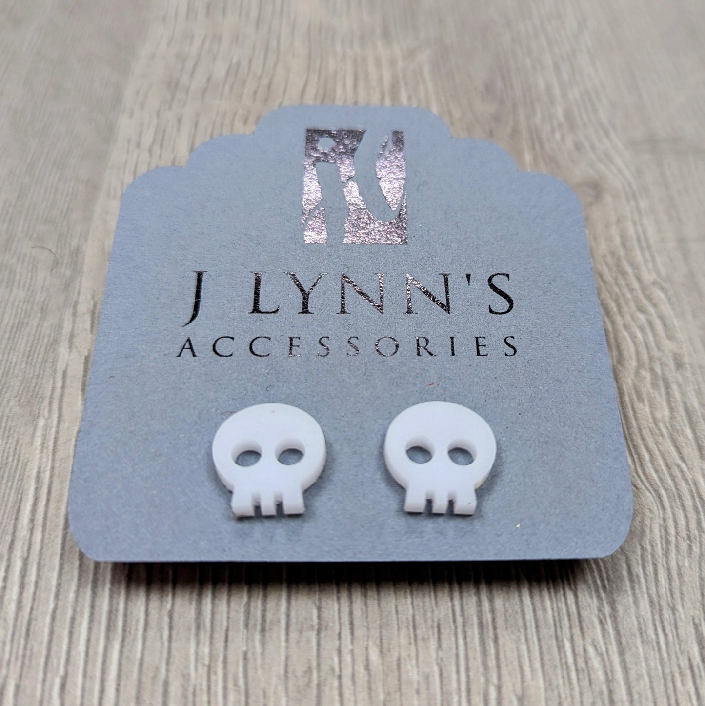 Acrylic skull earrings in white