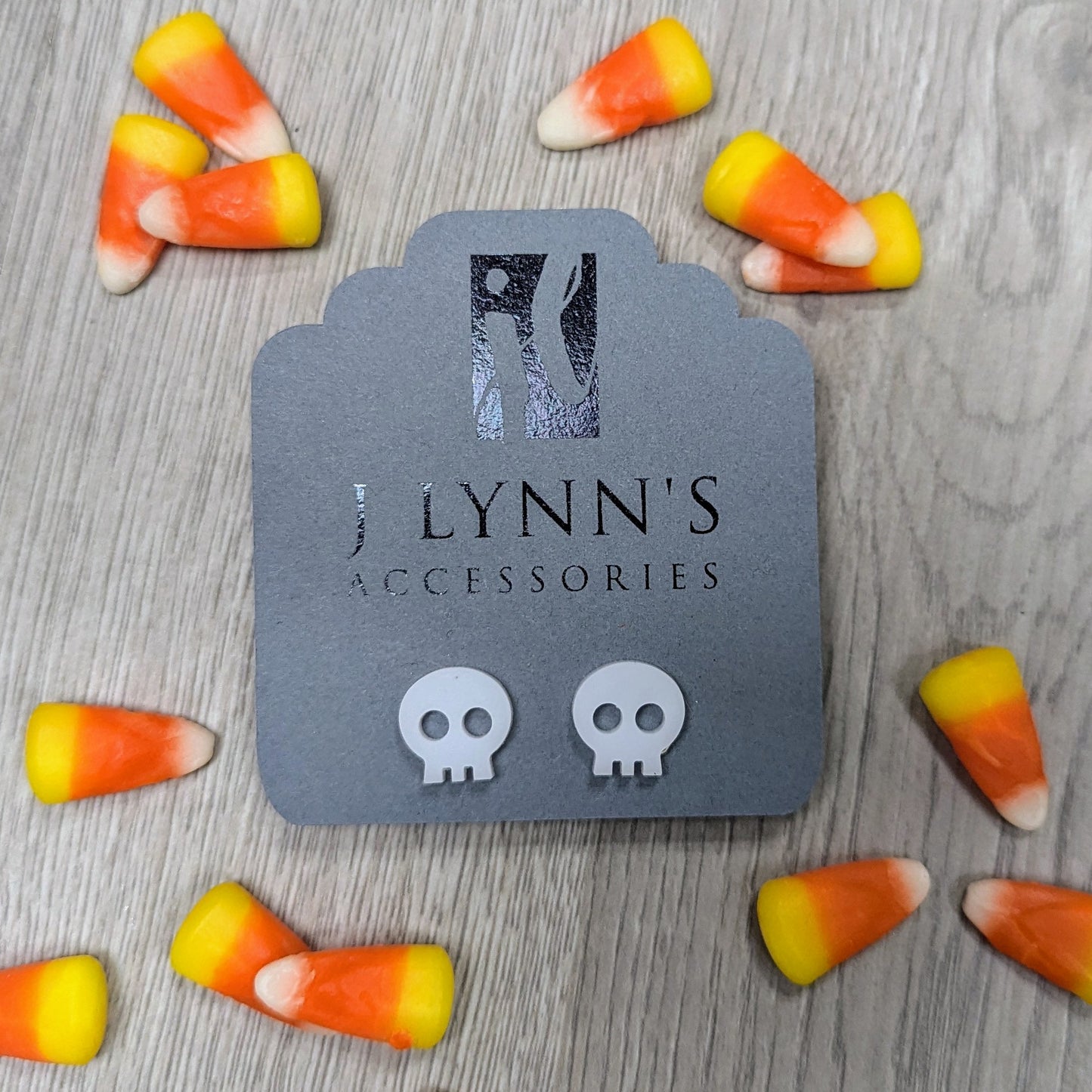 Acrylic skull earrings in white