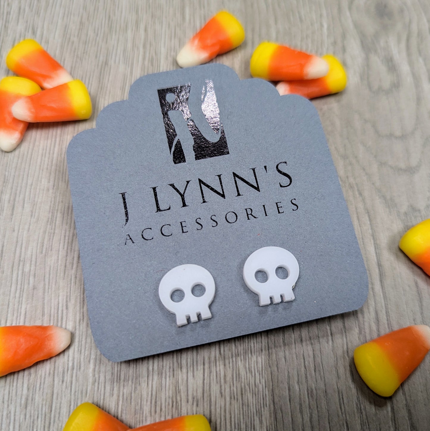 Acrylic skull earrings in white