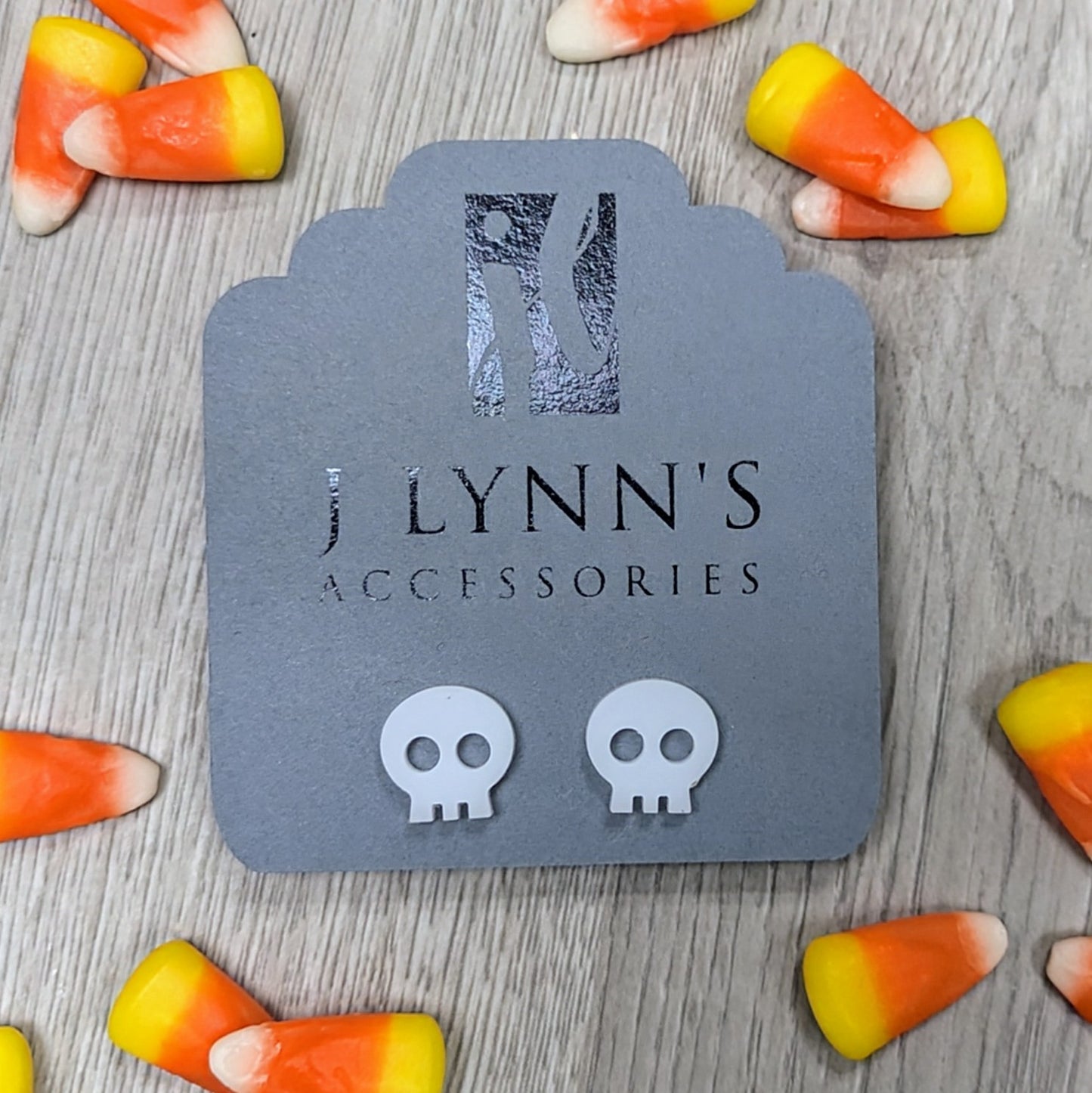 Acrylic skull earrings in white