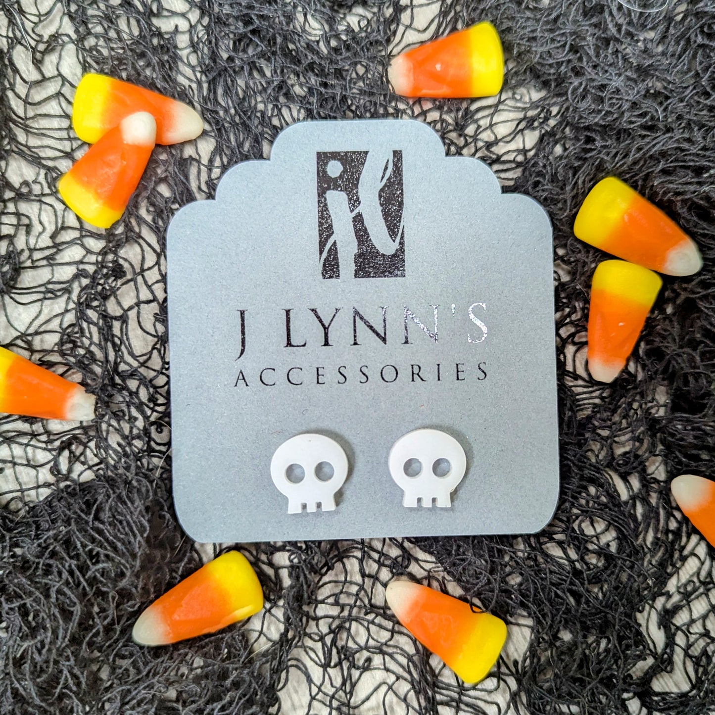 Acrylic skull earrings in white