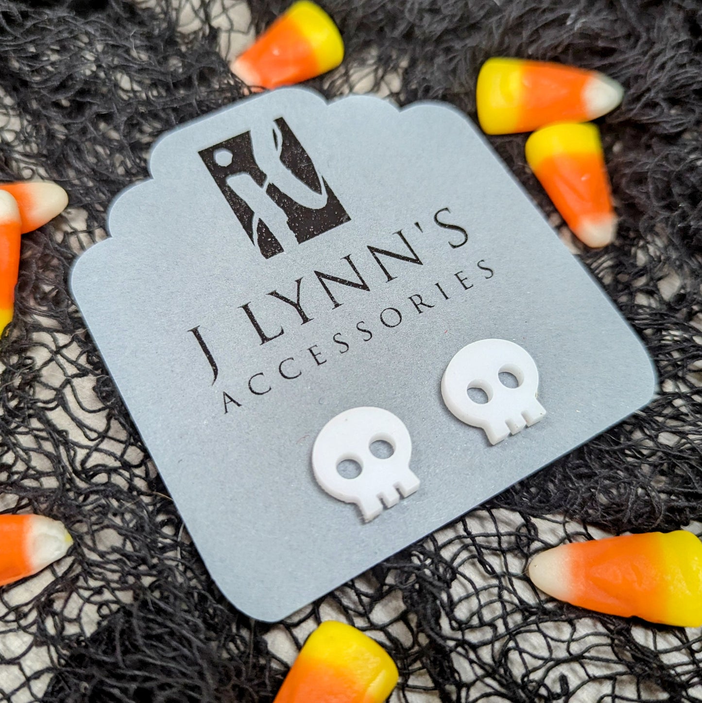 Acrylic skull earrings in white