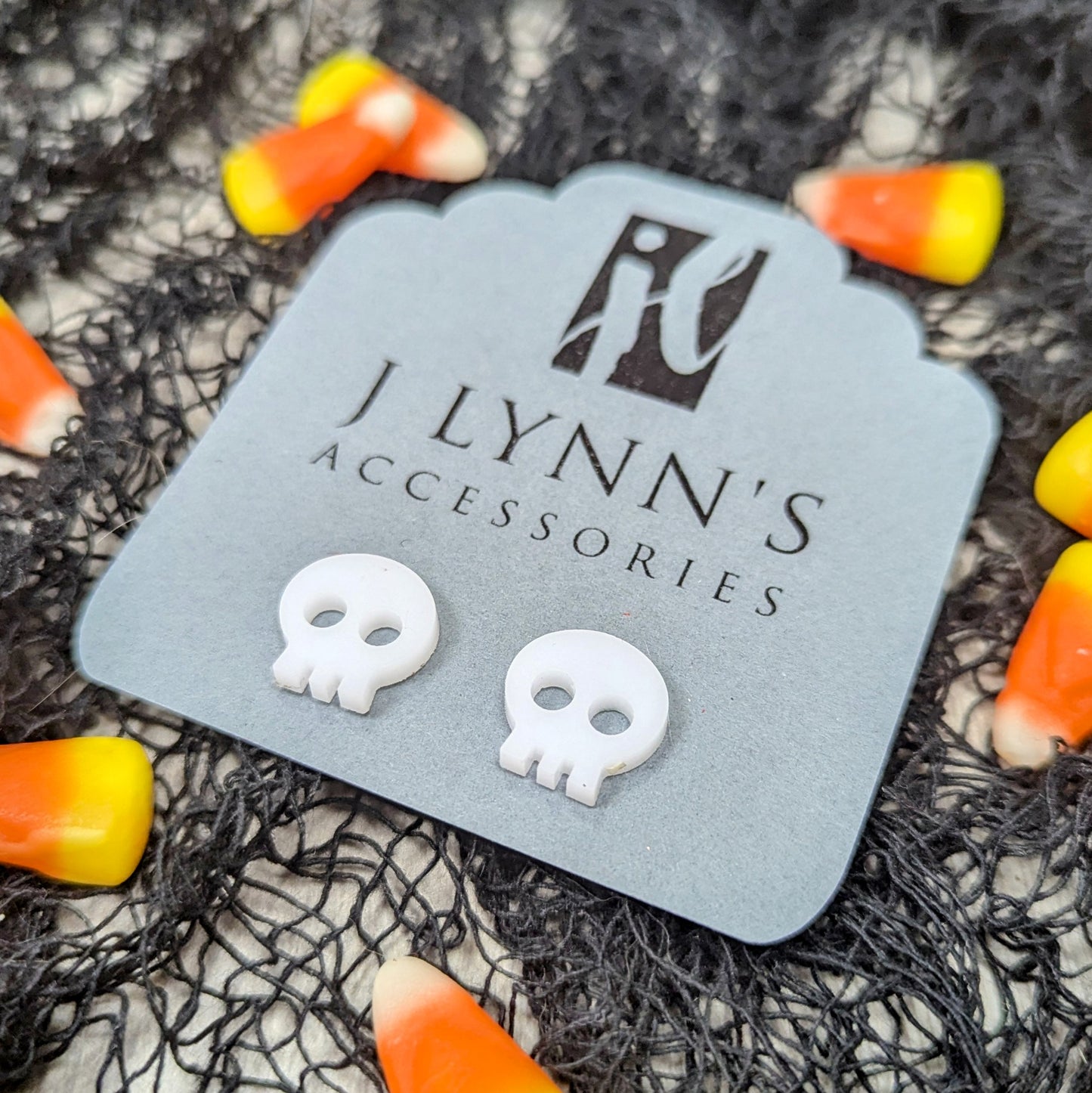 Acrylic skull earrings in white