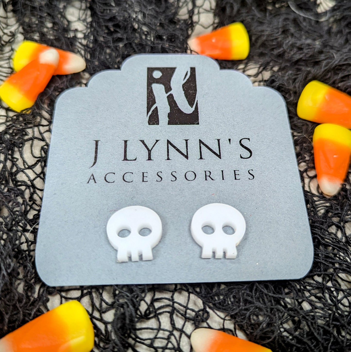 Acrylic skull earrings in white