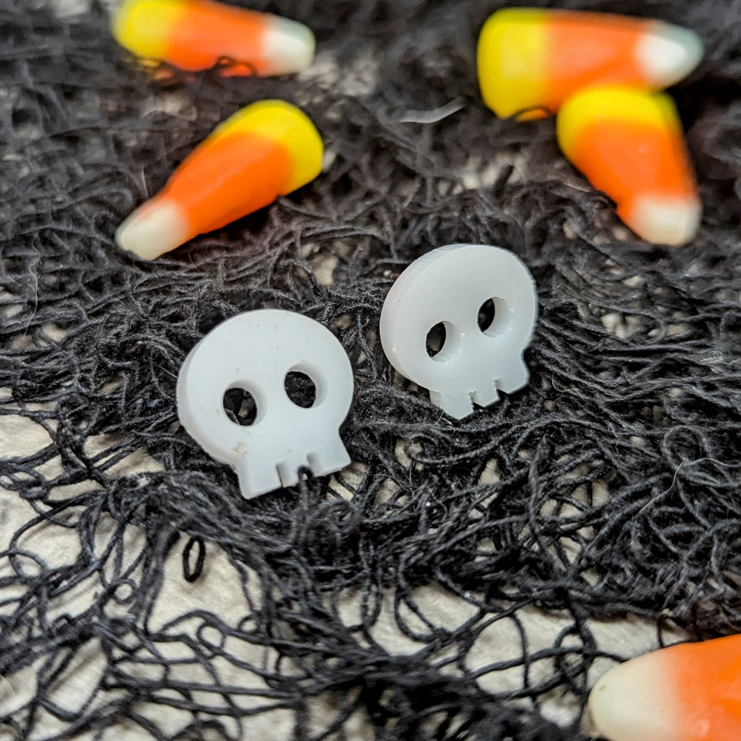 Acrylic skull earrings in white
