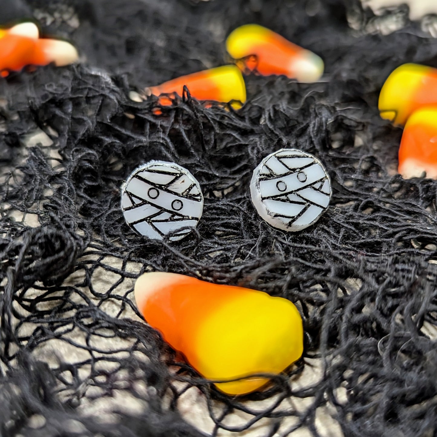 Acrylic mummy earrings in white with black detailing