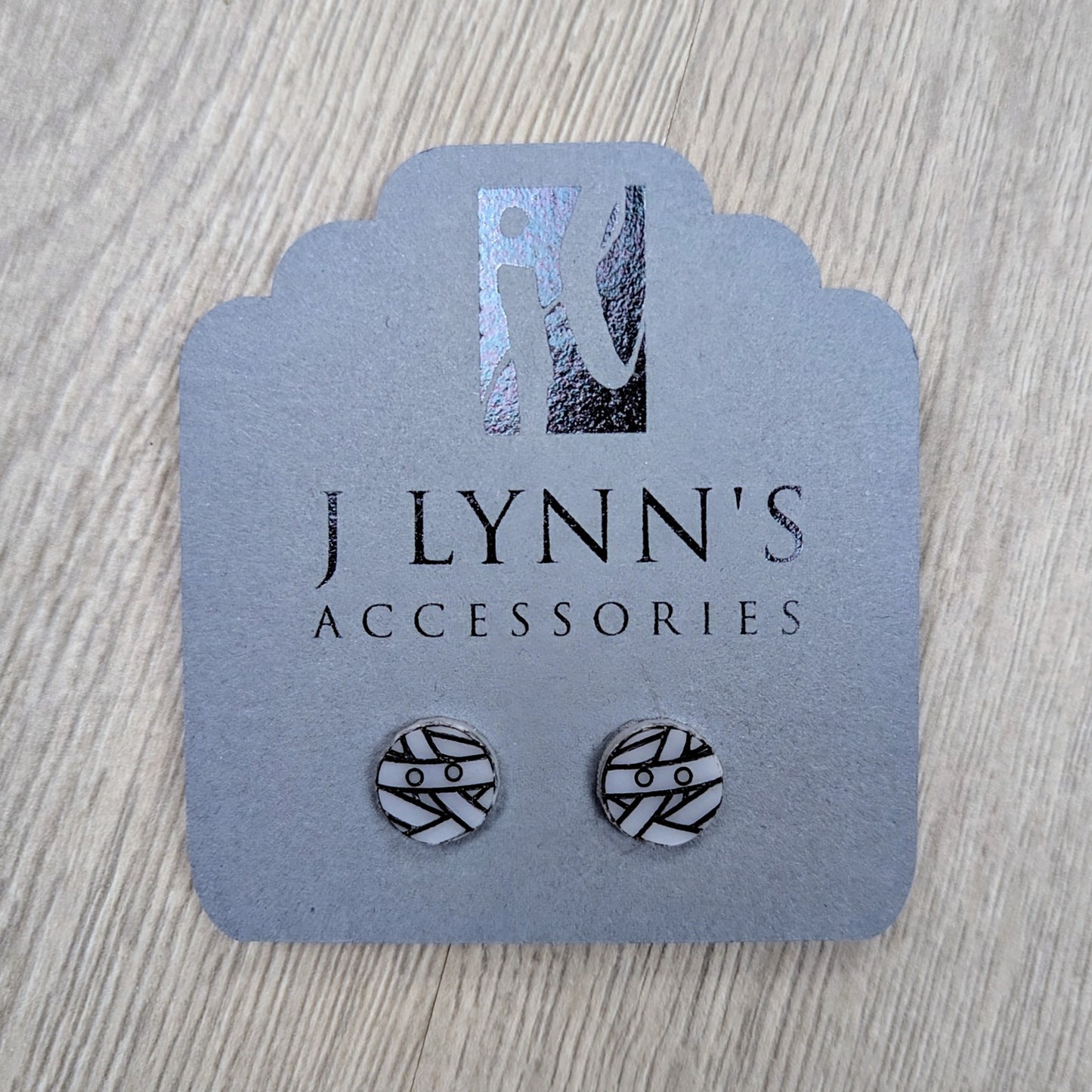 Acrylic mummy earrings in white with black detailing