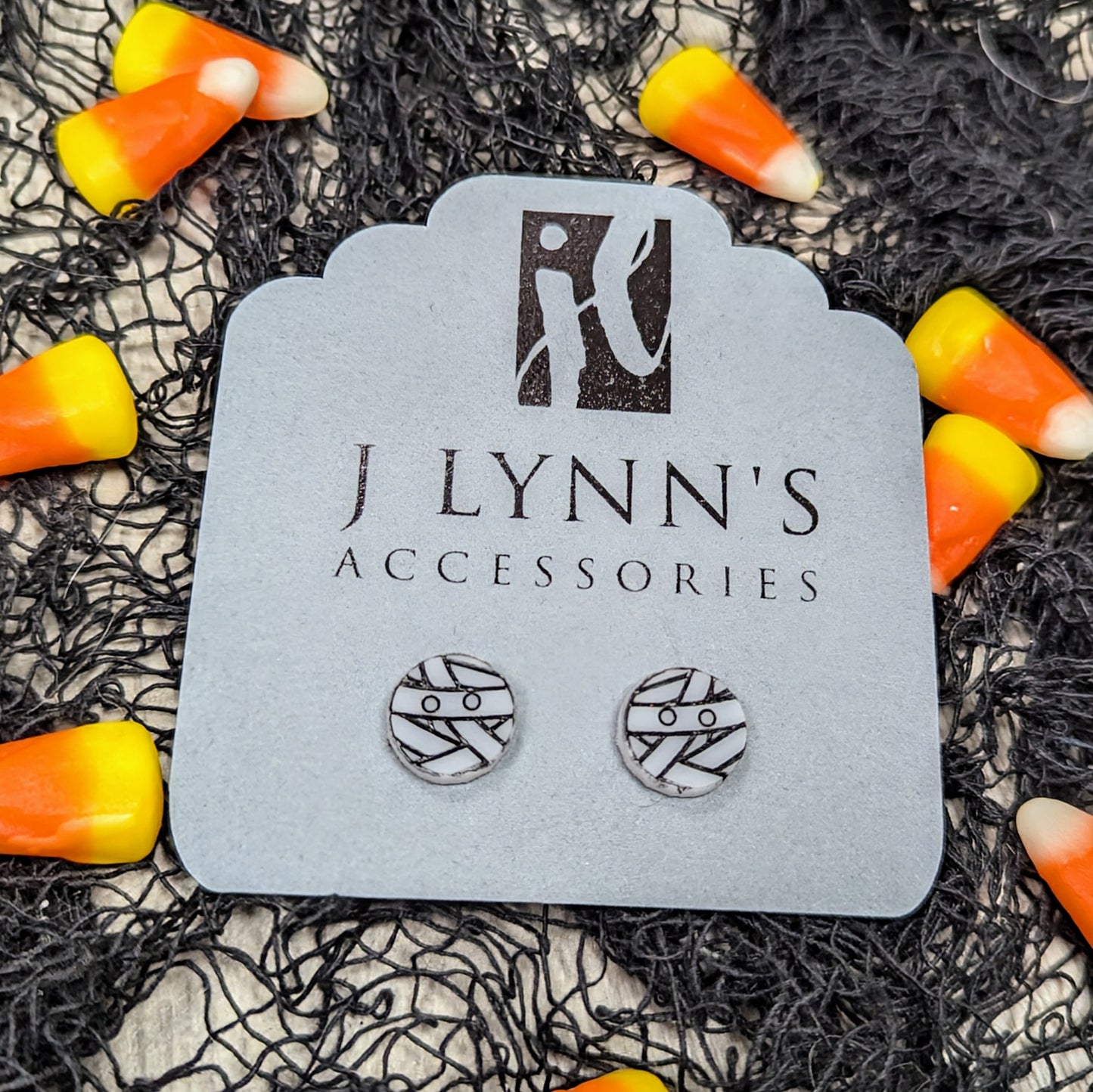 Acrylic mummy earrings in white with black detailing