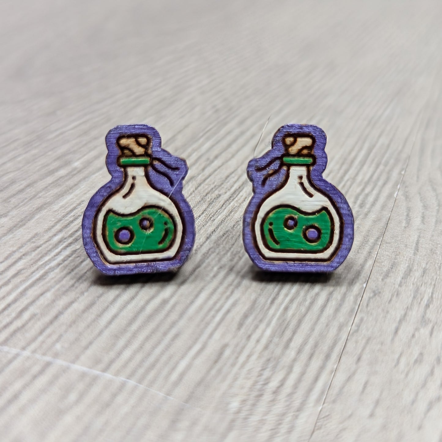 Hand painted poison bottle wooden stud earrings