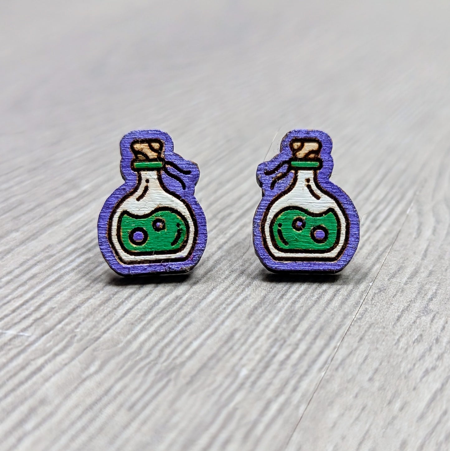 Hand painted poison bottle wooden stud earrings