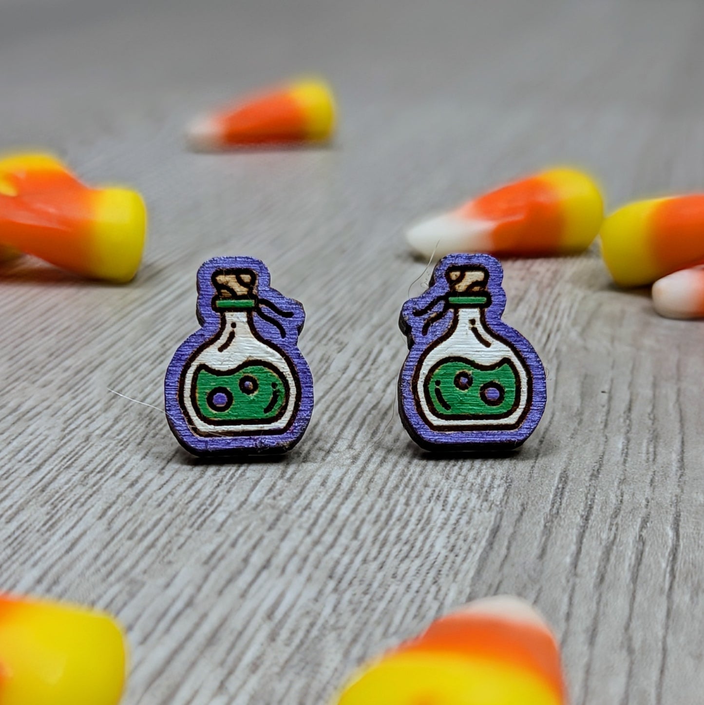 Hand painted poison bottle wooden stud earrings