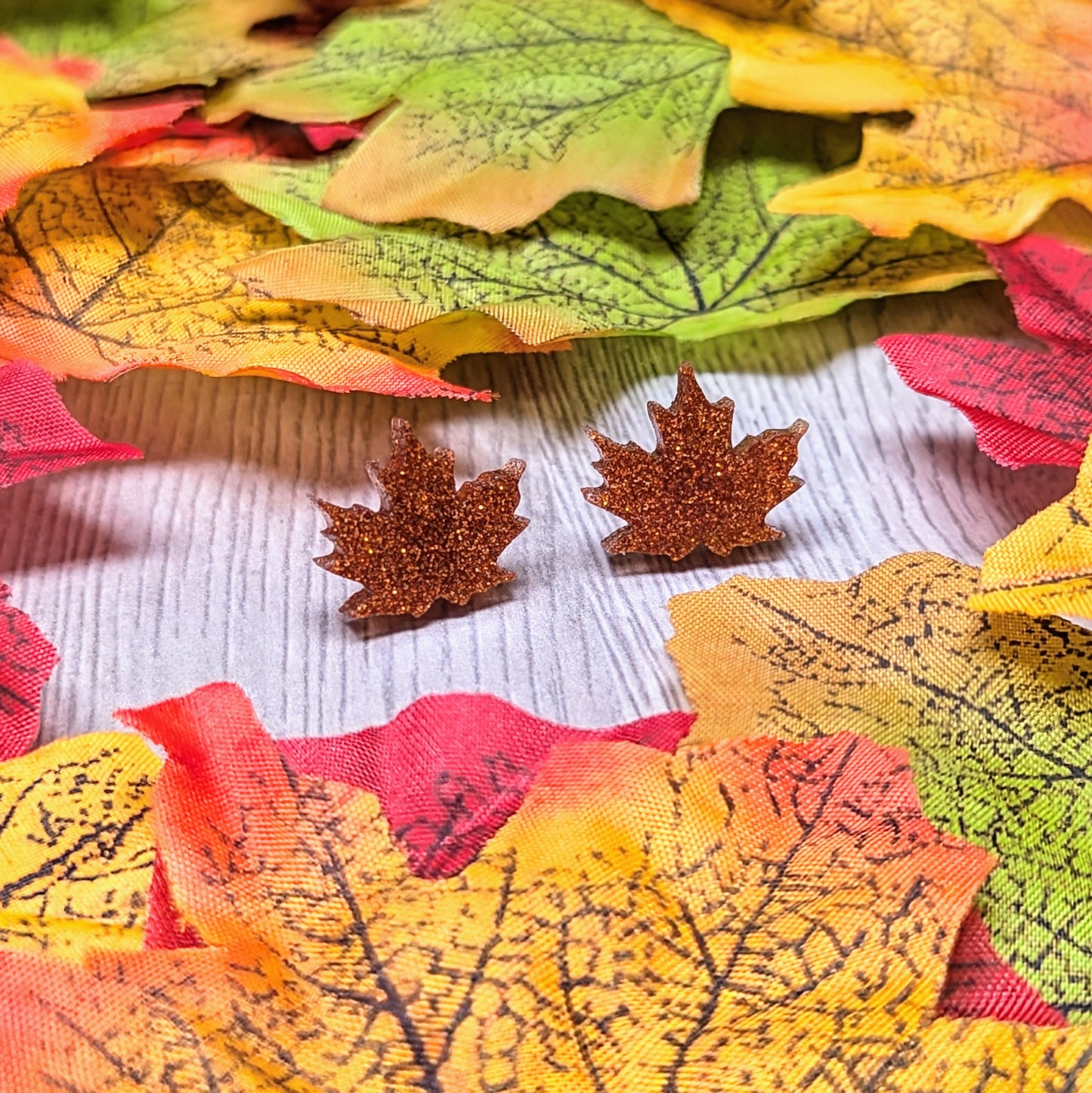 Acrylic glitter leaf earrings in an autumn harvest color
