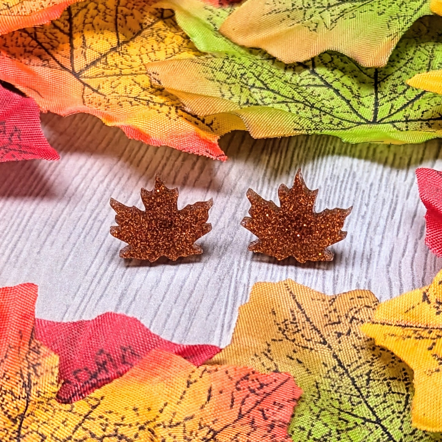 Acrylic glitter leaf earrings in an autumn harvest color